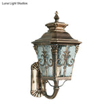 Country Brass Outdoor Wall Sconce With Pointed Flower Design