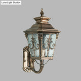 Country Brass Outdoor Wall Sconce With Pointed Flower Design