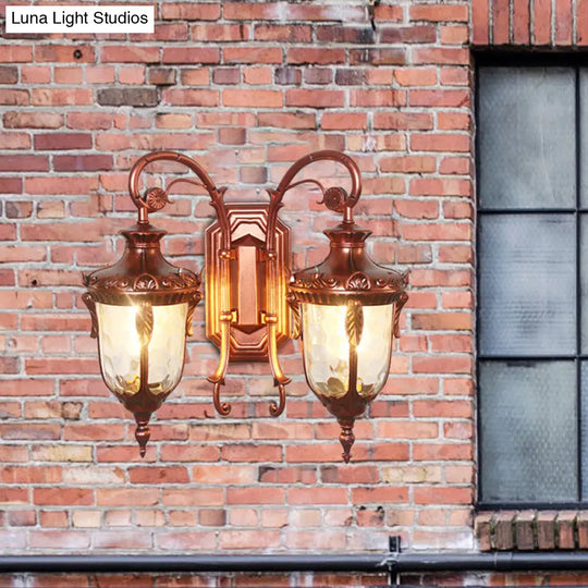 Countryside Black/Gold-Copper Urn Wall Sconce Light With Clear Glass - 2 Bulbs