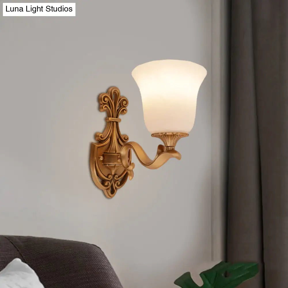 Countryside Opal Glass Wall Sconce With Brass Finish And Curvy Arm