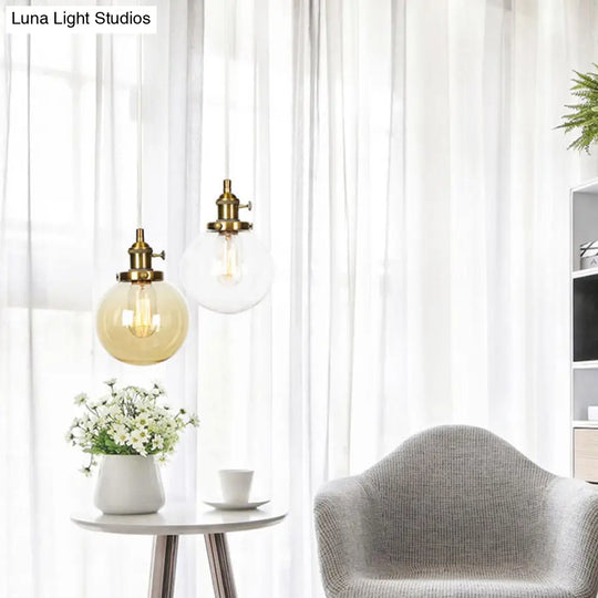 Farmhouse Hanging Pendant Light With Adjustable Cord And Amber/Clear Glass In Black/Bronze/Brass