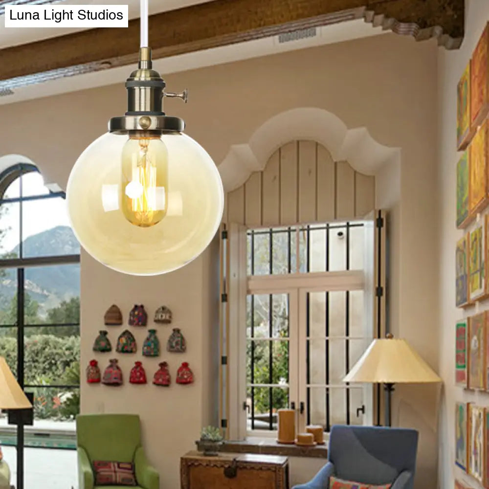 Farmhouse Orbit Pendant Light With Amber/Clear Glass And Adjustable Cord In 3 Elegant Finish Options