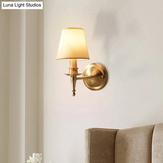 Gold Cone Wall Sconce With Single-Bulb Fabric Mount For Minimalist Lighting