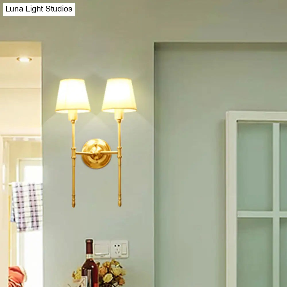 Golden Fabric Wall Sconce With Elongated Arm For Simplistic Bedroom Lighting