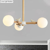 Japanese-Inspired Bedroom Chandelier With Orb Shade Birds Wood And Glass In White