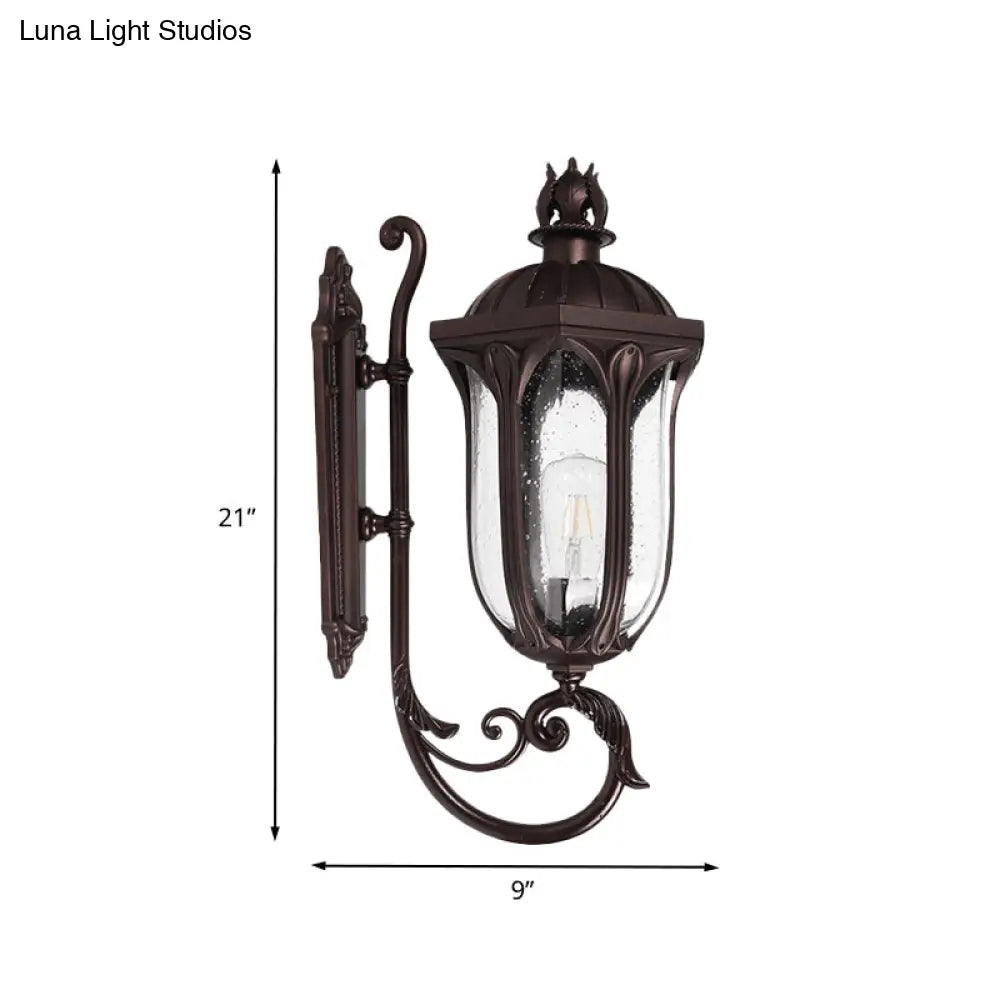 Lodge 1-Head Courtyard Wall Light Fixture With Seedy Glass And Swooping Arm In Dark Coffee