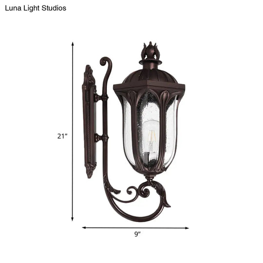 Lodge 1-Head Courtyard Wall Light Fixture With Seedy Glass And Swooping Arm In Dark Coffee