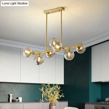Mid-Century Modern Gold Metal Pendant With Spherical Amber Glass - Island Ceiling Light For Dining