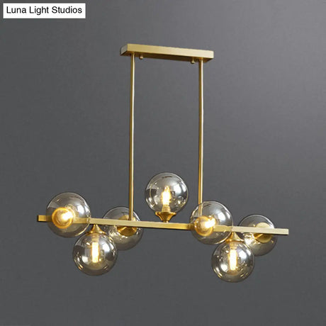 Mid-Century Modern Gold Metal Pendant With Spherical Amber Glass - Island Ceiling Light For Dining
