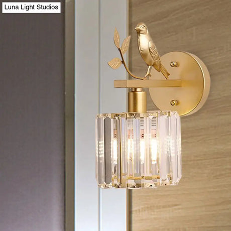 Minimalist Black/Gold Wall Sconce With K9 Crystal Cylinder And Bird Detail - 1 Bulb Light