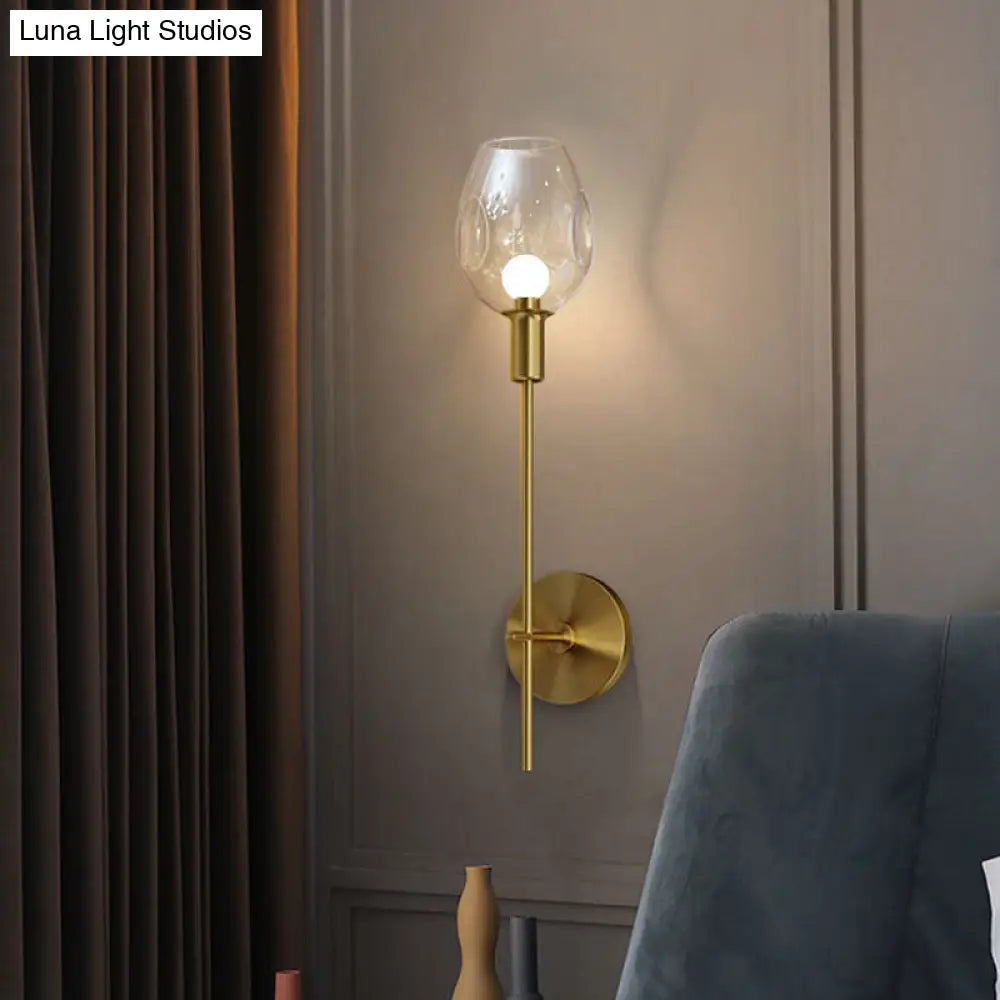 Minimalist Gold Sconce Wall Light With Clear Dimpled Cup And Pencil Arm For Hallway