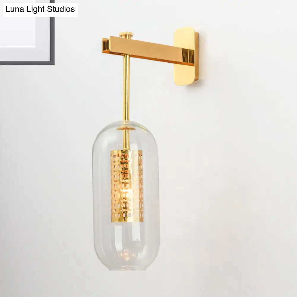 Modern 1-Light Clear Glass Tube Sconce - Brass Bedroom Wall Mount Lamp