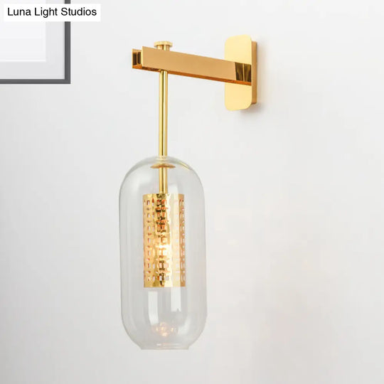 Modern 1-Light Clear Glass Tube Sconce - Brass Bedroom Wall Mount Lamp
