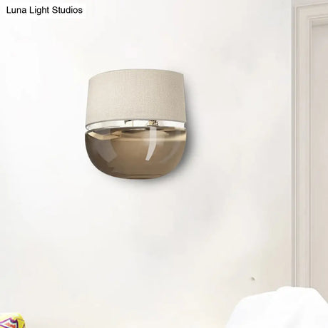 Modern Arched Wall Sconce In White With Grid Pattern Fabric And Tan Glass Bottom