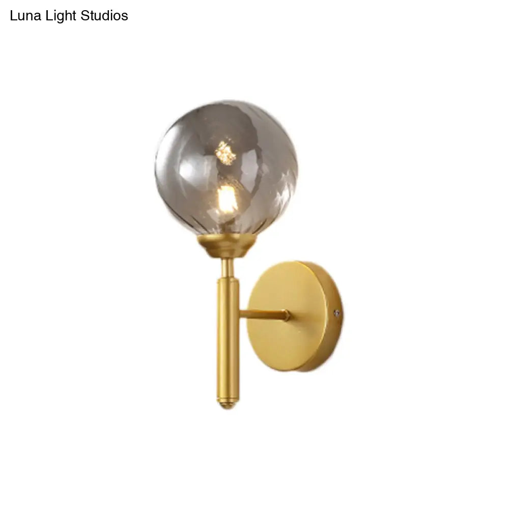Modern Brass Wall Light With Smoked Textured Glass Globe Bulb