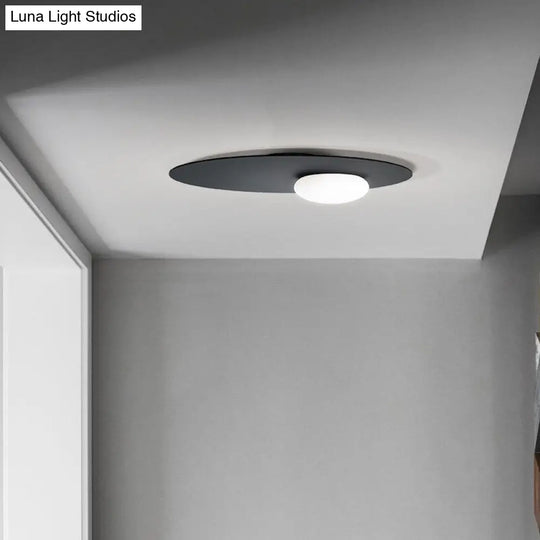 Modern Cream Glass Flush Mount Lamp: Designer 1-Light Ceiling Fixture With Black/Brass Disk Top