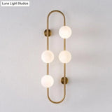 Modern Gold Oblong Sconce Wall Light With 4-Metal Heads And Milky Glass Shade