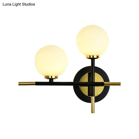 Modern Milk Glass Orb Sconce Wall Light - 2 Lights Black And Brass Cross Design