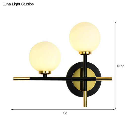 Modern Milk Glass Orb Sconce Wall Light - 2 Lights Black And Brass Cross Design