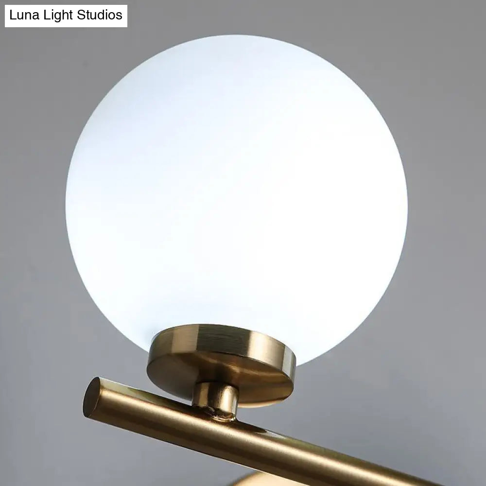 Modern Opal Glass Wall Sconce With Globe Shade And Gold Accent For Washroom Lighting