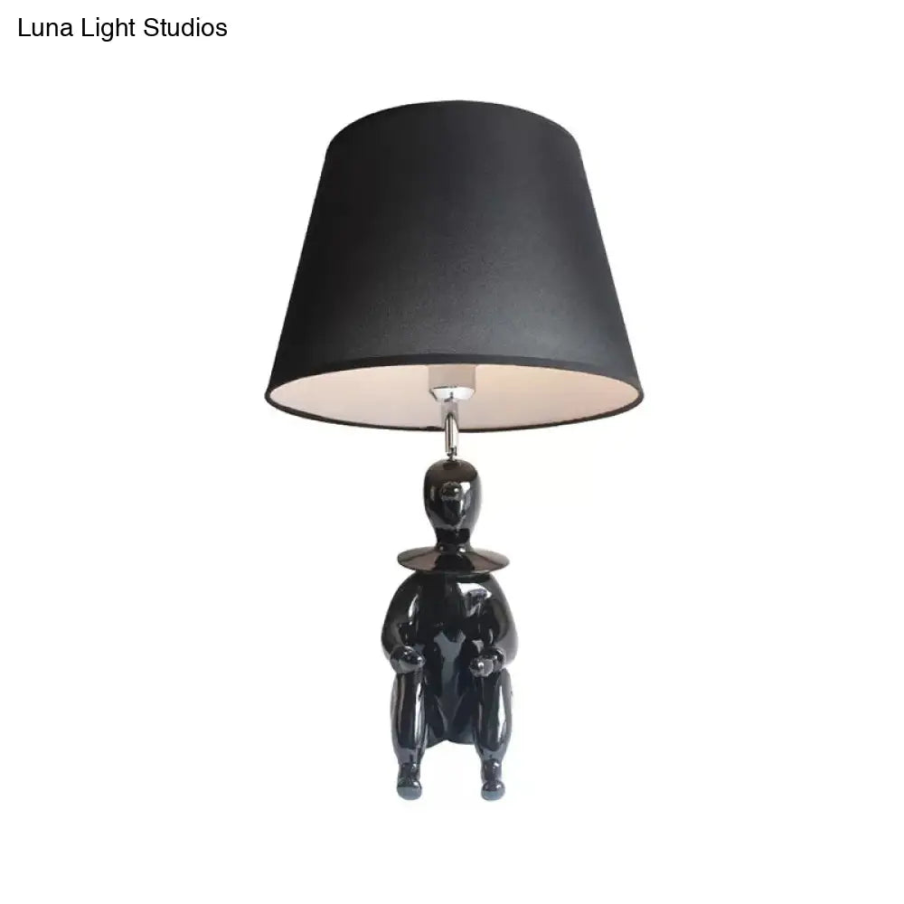 Modern Resin Sitting People Desk Lamp With Tapered Shade - 1 Bulb Light For Kitchen