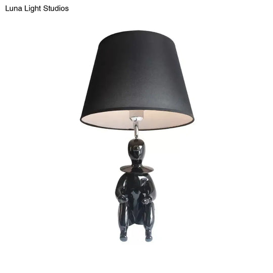 Modern Resin Sitting People Desk Lamp With Tapered Shade - 1 Bulb Light For Kitchen
