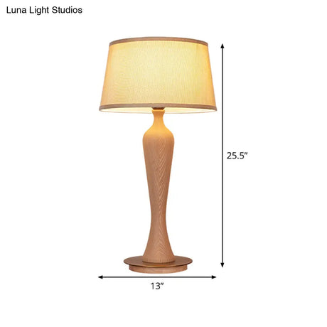 Modern Urn-Shaped Wood Desk Lamp In Beige - 1 Bulb Table Light With Drum Fabric Shade