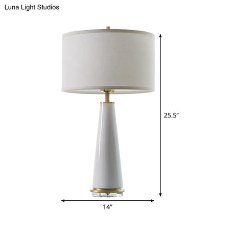 Modern White Fabric Cylinder Table Light With Cone Ceramic Base - 1 Bulb Desk Lamp
