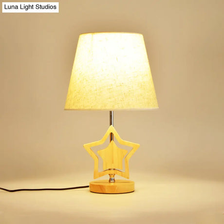 Modern Wood Star Nightstand Lamp With Beige Barrel Fabric Shade