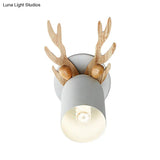 Modernist Metal Wall Sconce With Antler Design And Cylinder Shape For Bedroom Lighting