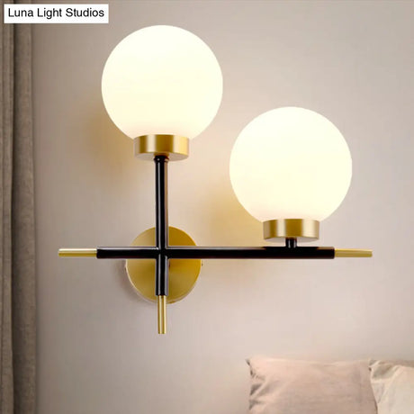 Post-Modern White Glass Sphere Wall Sconce With Brass Finish - 1/2 Bulbs