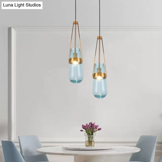 Clear/Blue Glass Pendant Lamp With Brass Gripper - Postmodern Drop Shape Dining Room Hanging Light