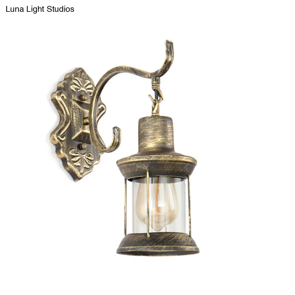Rustic Wall Mounted Kerosene Light Fixture With Carved Pattern - Aged Bronze Finish Clear Glass