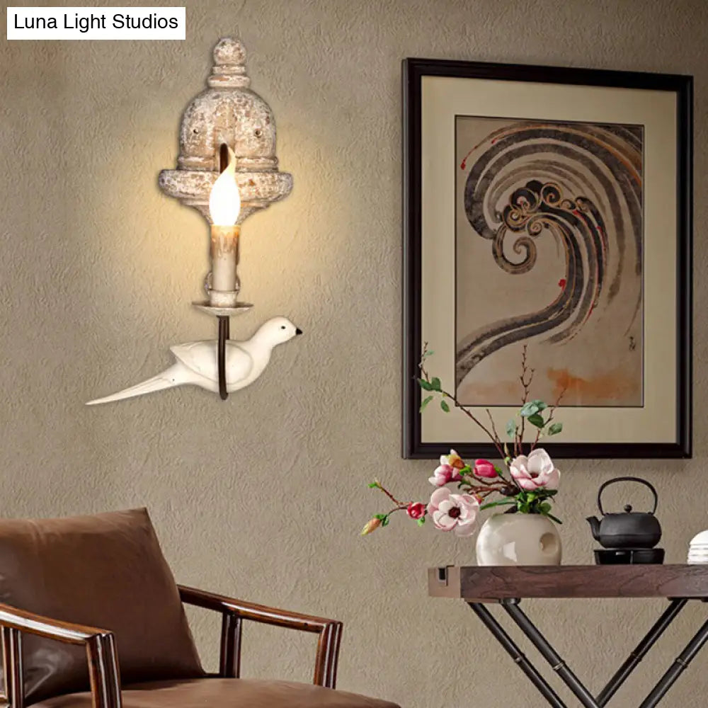 Rustic Wood Swooping Arm Wall Lamp With Distressed White Sconce - Decorative Candle And Bird Accents