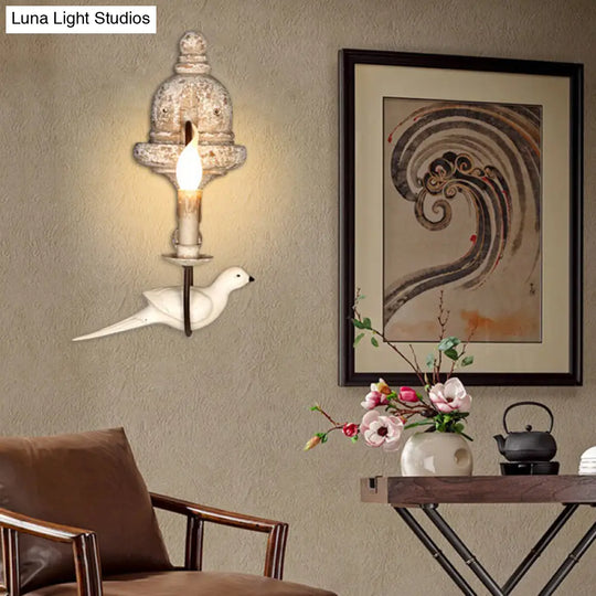 Rustic Wood Swooping Arm Wall Lamp With Distressed White Sconce - Decorative Candle And Bird Accents