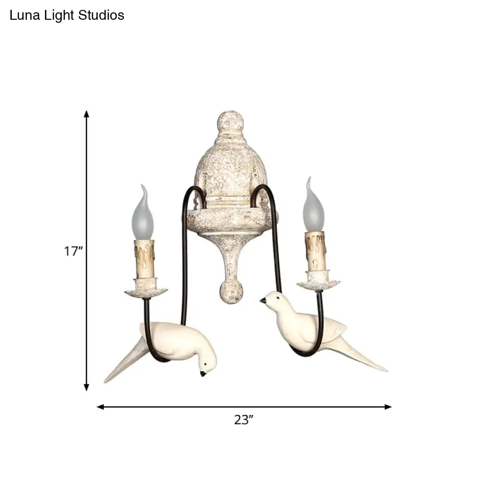 Rustic Wood Swooping Arm Wall Lamp With Distressed White Sconce - Decorative Candle And Bird Accents