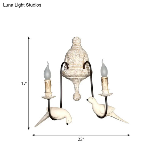 Rustic Wood Swooping Arm Wall Lamp With Distressed White Sconce - Decorative Candle And Bird Accents