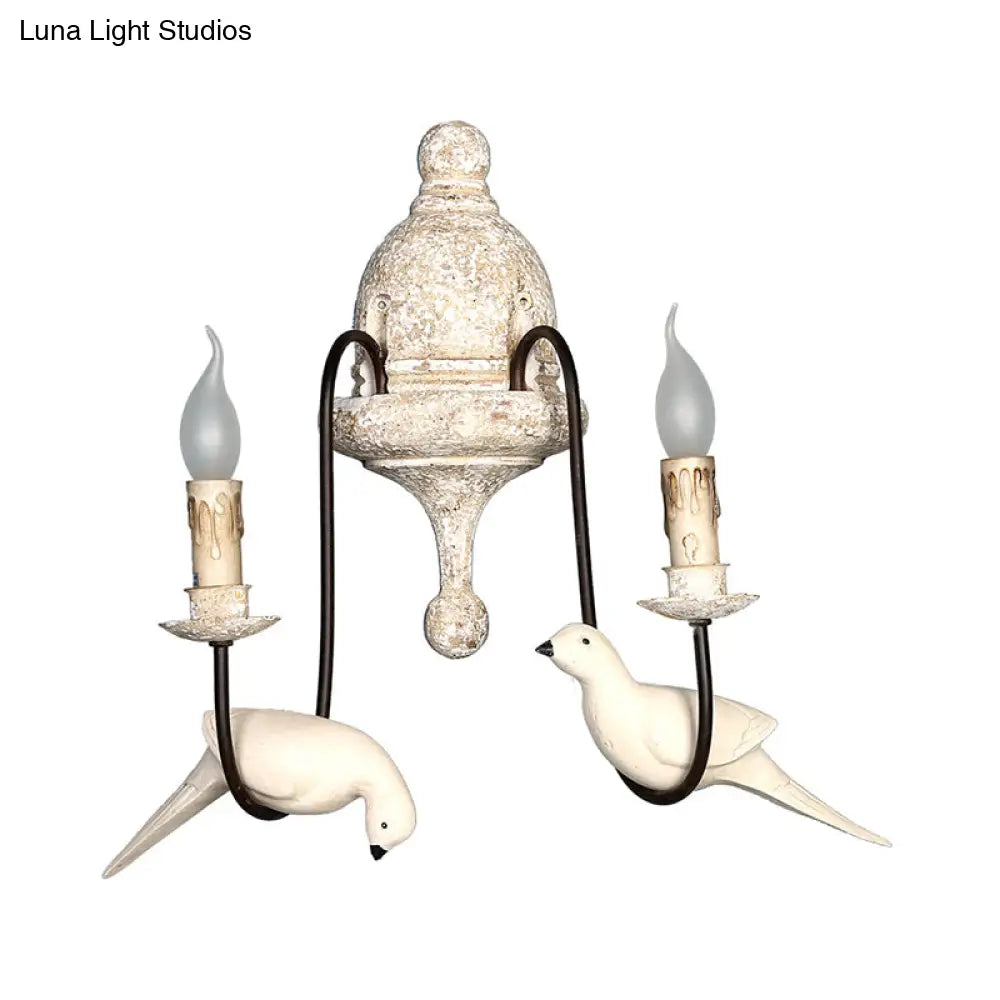 Rustic Wood Swooping Arm Wall Lamp With Distressed White Sconce - Decorative Candle And Bird Accents