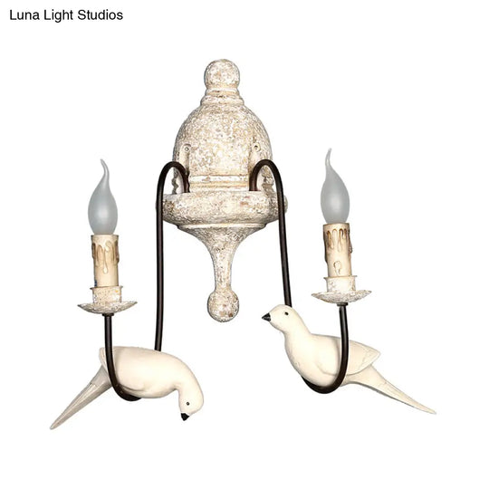 Rustic Wood Swooping Arm Wall Lamp With Distressed White Sconce - Decorative Candle And Bird Accents