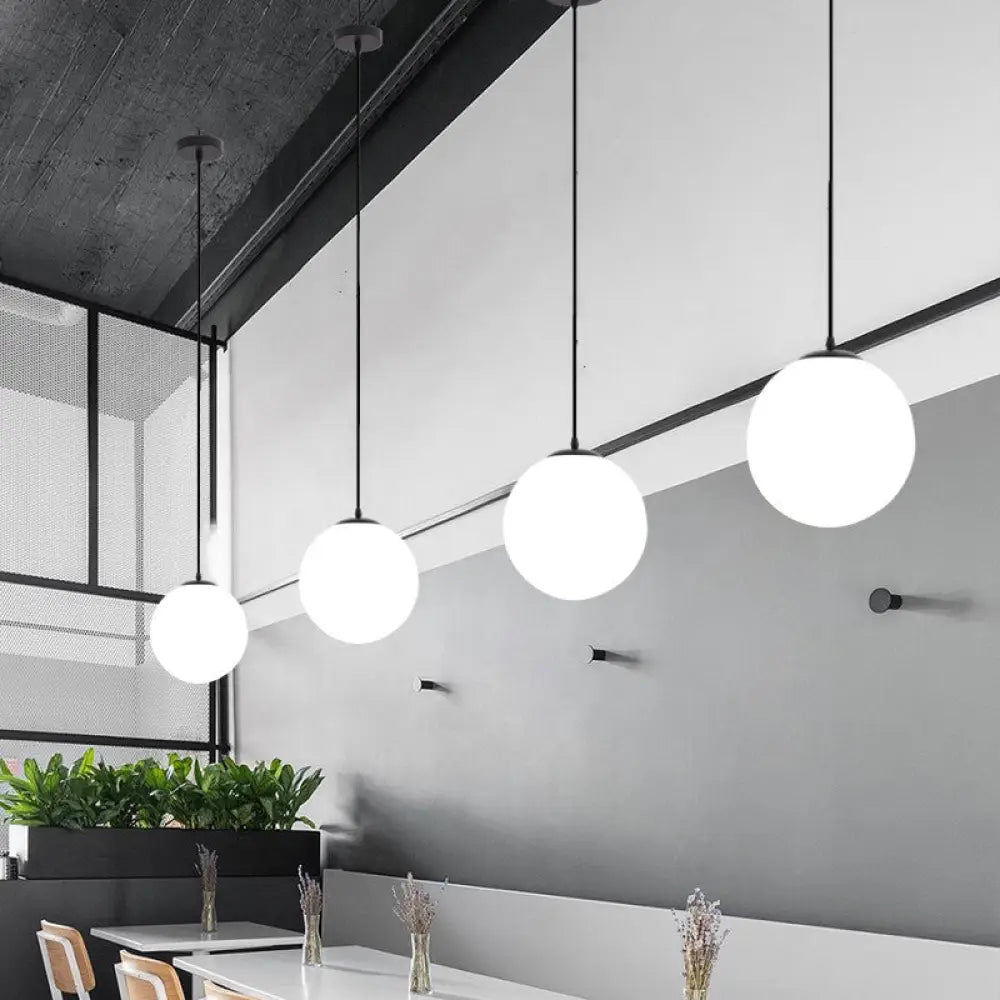 Sleek Black Sphere Restaurant Pendant Light With Cream Glass Shade - Simple Ceiling Hang Lamp