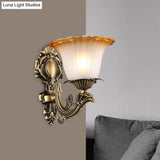 Vintage Floral Wall Sconce With Frosted Glass And Carved Brass Arm
